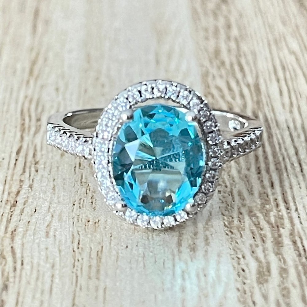 Oval Simulated Light Blue Topaz Halo Ring - 925 Sterling Silver